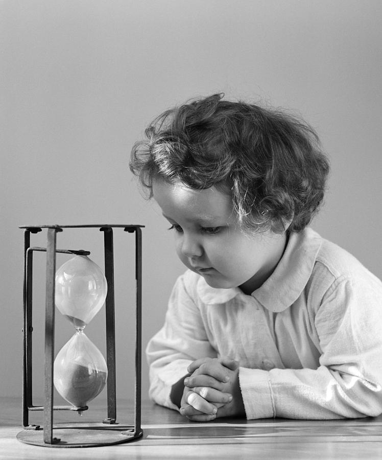 little-girl-watching-hourglass-c1940s-h-armstrong-robertsclassicstock.jpg